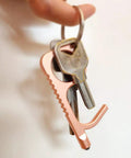 No Touch Door Opener Tool With Stylus And Button Pusher in rose finish on keyring, multifunctional no contact entry helper.