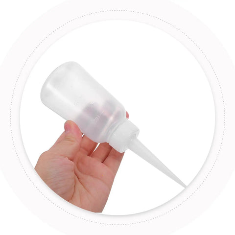 Needle Tip Glue Applicator Bottles With Fine Point Nozzles, Handy Portable Glue Dispenser Set Of 12 For Crafting, Model Making, Electronics, Repairs, And Precision Glue Application. clear plastic squeeze bottle with needle tip nozzle in hand