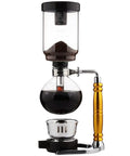 Straight Fire Borosilicate Glass Siphon Coffee Maker With Heavy Duty Stainless Base And Precision Alcohol Burner For Smooth Cold Brew And Iced Coffee Vibes Tabletop Ready with coffee grounds in top chamber.