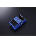 SY-1 Guitar and Bass Synth Pedal With Polyphonic Synth Engine, Hold Function, Expression Input, blue pedal on black surface.