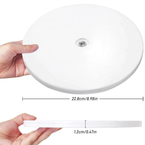 Person holding 9 Inch White Acrylic Lazy Susan Turntable With Ball Bearing Rotation Holds Up To 55 Lb Spices, Cake Stand.