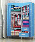 Solid Portable Bedroom Closet With Willow Wood Frame And Thick Non Woven Fabric Storage Organizer For Hanging Clothes And Quilts No Fuss Smooth Assembly Heavy Duty Space Saver with colorful striped clothing.