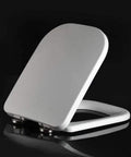Heavy Duty Square Toilet Seat Boasting Dead Quiet Soft Close Hinges And Ridiculously Simple Quick Release Hardware Painted In Crisp White Durable Duroplast for standard bathrooms, side view.
