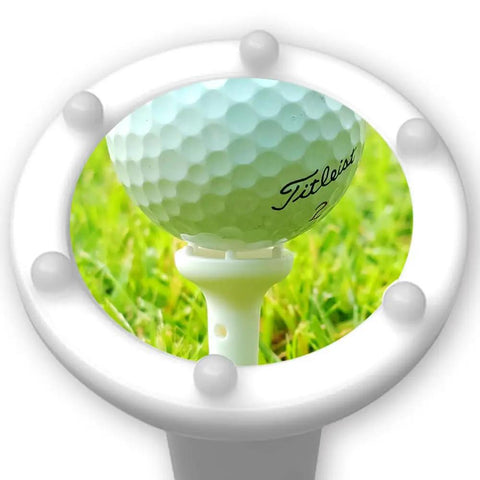 Golf ball on Big Easy White Golf Tees Set With 0.75 Inch Big Head 3.25 Inch Adjustable Height 6 Prong in grass