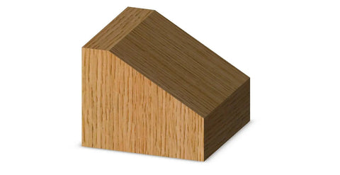 Wooden block with a 60-degree chamfer cut, demonstrating edge bevel created by 60 Degree Chamfer Router Bit With Carbide Tip Half Inch Shank Two And A Half Inch Diameter One And One Eighth Inch Cutting Length Nine Sixteenths Inch Cutting Height Ideal For Delicate Edge Bevels On Half Inch Collets.
