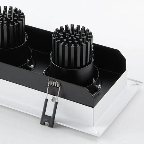 Close-up of 4 Pack Adjustable Recessed Led Downlights With Snap Swivel Angles and Clean Aluminum Trim, showcasing heat sink design.