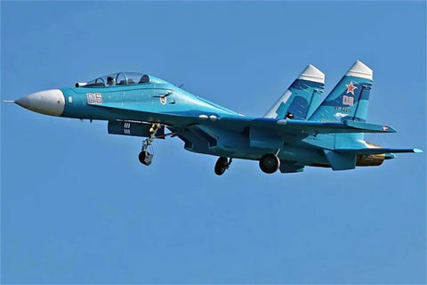 Blue 6 Channel RC Plane SU 27 70mm Ducted Fan EDF With 12 Blade Inrunner Motors in flight, clear sky background.