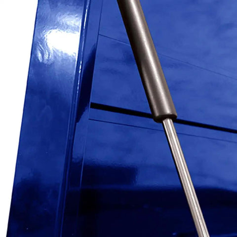 Close-up of blue gas strut on 36 Inch 8 Drawer Blue Top Chest With Full Extension Ball Bearing Slides Gas Struts EVA Drawer Liners And Top Mat Aluminum Pulls Secure Tubular Locking Power Cord Access Heavy Duty Garage Tool Storage