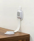 No Drill Anti Tip Furniture Straps With Heavy Duty Adhesive Wall Anchors mounted on wall, ideal for securing dressers.