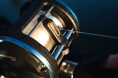 Tough As Nails Saltwater Level Wind Fishing Reel Size Thirty Featuring Graphite Housing Brass Main Gear showing line guide mechanism.