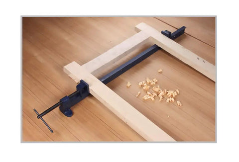 No Nonsense Heavy Duty T Bar Clamp With 48 Inch Frame And 42 Inch Jaw Width, Cold Drawn Steel Bar, Malleable Iron Head And Pin Locking Slide, Pro Shop Favorite Built Tough For Serious Woodworking And Assembly Projects in use with wooden pieces.