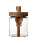 Go Ahead And Upgrade Your Countertop Setup With This Solid Clear Glass Storage Jar Featuring An Airtight Sealed Kitchen Canister And Wooden Spoon For Coffee Beans 900Ml Capacity Handles Dry Goods Smoothly And Looks Dope - front view with wooden lid and spoon.