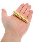 Hand holding a small brass component from Heavy Duty Dent Puller Kit For Auto Body Repair And Car Sheet Metal Iron Tool