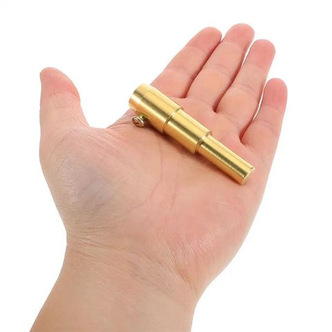 Hand holding a small brass component from Heavy Duty Dent Puller Kit For Auto Body Repair And Car Sheet Metal Iron Tool