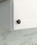 Ravenna Series Solid Traditional Kitchen Cabinet Pull Handle Knob One And One Quarter Inch Oil Rubbed Bronze 10 Packs installed on cabinet