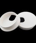 Six Pack White Plastic Desktop Cable Hole Covers With Removable Snap Top Two Point Five Inch Wire Grommets on a black background.