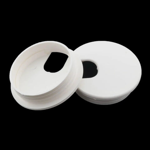 Six Pack White Plastic Desktop Cable Hole Covers With Removable Snap Top Two Point Five Inch Wire Grommets on a black background.