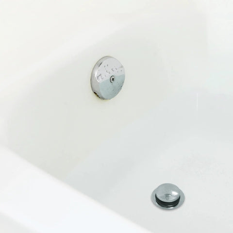 Chrome Touch Toe Tub Stopper Fits 2 Inch Cross Arm Drains With Adapters For Five Sixteenths And Three Eighths Inch Thread Sizes Hands Free Press To Close Or Open No Tools Required Bathroom Drain Accessory installed in a bathtub