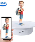 cexuw 360 Degree Electric Turntable For Small Product Display, 7.87 Inch diameter showing animated figure on stand.