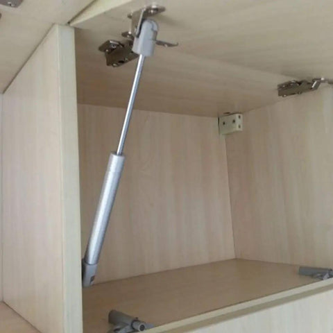 Two Pack Heavy Duty Black Gas Strut Lift Supports For Kitchen Cupboard Doors installed in a cabinet with smooth hydraulic hinge.