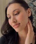 Petite Trinity Ball Stud Earrings In 18K Gold Plated Minimalist Delicate Jewelry With A Tiny Three Ball Cluster For Everyday Wear And Effortless Subtle Shine For Casual Cool Everyday Vibe, worn close-up