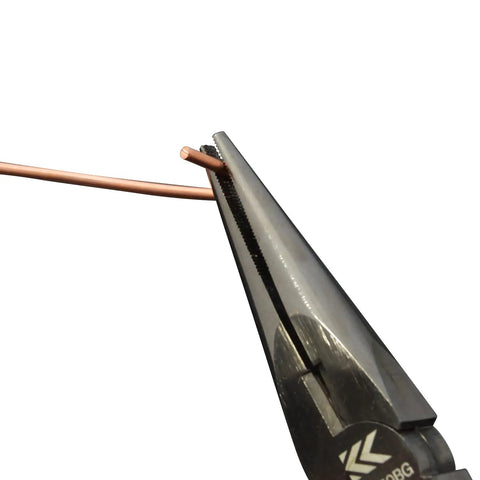 Radio Pliers With Cross Knurling Shaft Black Gold Finish cutting copper wire, showing sharp precision tip and secure grip.