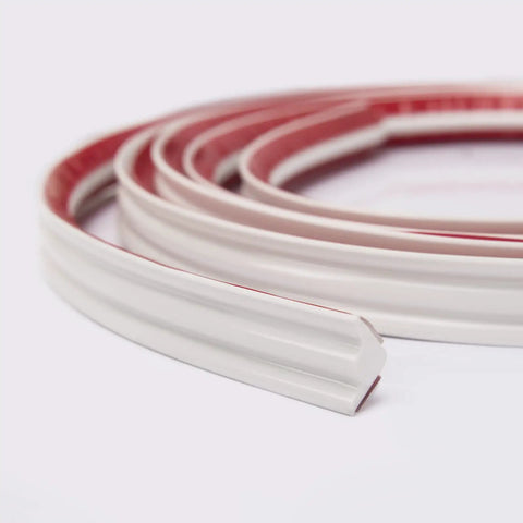 Close-up of Peel And Stick Flexible Quarter Round Molding Trim For Walls Ceilings Cabinets Countertops Floors Edges And Corners, 10 ft, white
