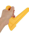 Hand holding yellow V Type Push Sticks For Table Saw And Router Woodworking Set Ergonomic ABS Hand Push Sticks Keeps Hands Safe And Prevents Kickback In Carpentry 2 Pack.