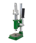 Heavy Duty Manual Arbor Press Rock Solid Benchtop Stamping Machine For Leather Crafting Hole Punching Copper Cutting Easy On The Hands Spring Loaded Workhorse For Daily Use, green metal design with spring mechanism and handle.
