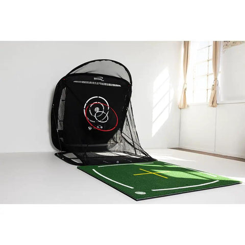 Compact Golf Practice Net 5 Foot By 5 Foot Indoor And Outdoor Hitting Net With Ball Return, set up in a sunlit room.