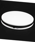 Sparkling 360 Rotating Turntable Display Stand For Jewelry Watches And Digital Products Mirror Base Electric Spin Platform view from top with smooth ABS construction.