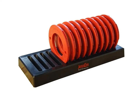 Premium Router Lift With Dead Smooth Height Adjustment And Tough As Nails Top Plate Includes Full Ten Piece Insert Ring Set Plus Quick Access Storage Tray For Woodworking Pros, featuring ten orange insert rings on a black storage tray.