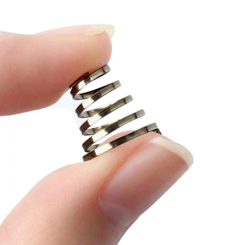 Hand holding a stainless steel spring from 10 Pack Bike Wheel Quick Release Spring Skewers Stainless Steel Rustproof High Tension Durable Spring Pads