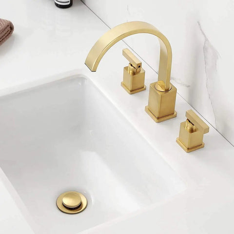 Brushed Gold Two-Handle Bathroom Faucet, 8-Inch Widespread 3-Hole Sink Fixture installed on white sink counter.