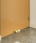 Adjustable Roller Ball Door Catch For Cabinets, Closets, And Wardrobes, Double Roller Hardware on wooden door, copper finish.