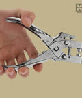 Hand holding All In One Grab And Go Eyelet Grommet Pliers Kit With 1 Hole Punch and 100 Gold Grommets for leather, canvas, and crafts