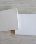 Two stacked boron nitride ceramic sheet pads, 150 x 150 x 2 mm, for heat proof performance, nonstick surfaces, corrosion resistance.