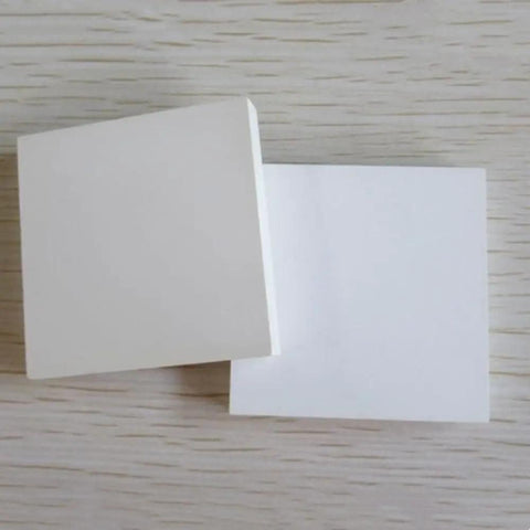 Two stacked boron nitride ceramic sheet pads, 150 x 150 x 2 mm, for heat proof performance, nonstick surfaces, corrosion resistance.