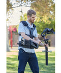 Person using Steadimate RS Gimbal Base And Balance Stud for DJI Ronin RS 2 RS 3 RS 3 Pro And RS4 Pro outdoors for steadier video
