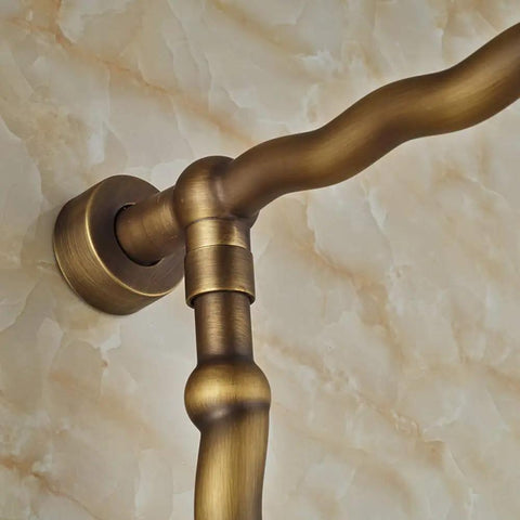 Close-up of antique bronze shower pipe with joint, part of UMJIGF 8 Inch Antique Shower System with Hot and Cold Water Shower Combo Set.