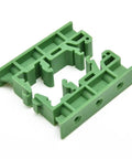 Knockout Slick 35mm Din Rail Mount Adapter Kit For Circuit Boards Loaded With Five Green C45 Plastic Brackets And Hardware, close-up of green plastic bracket.