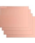 Four FR4 Copper Clad Single Sided PCB Boards Five Pack 5x7cm And 10x15cm For DIY Projects stacked horizontally, showing flatness