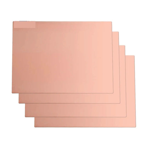 Four FR4 Copper Clad Single Sided PCB Boards Five Pack 5x7cm And 10x15cm For DIY Projects stacked horizontally, showing flatness