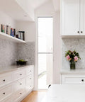 Stylish kitchen with white cabinets featuring black round cabinet knobs set of 50 pieces, 1.2 inch diameter, plastic drawer pulls.