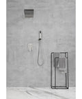 Shower System with Waterfall Rainfall Head, Handheld, Wall-Mounted Faucet on a textured gray wall with towels.