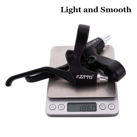 Beefy Aluminum Alloy Bike Brake Levers 2 Pack on scale, showing weight of 186g, compatible with caliper, side pull V and disc brakes