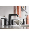 Genta 8-Inch Widespread Two-Handle Bathroom Faucet In Matte Black With Durable Finish, Smooth Ceramic Valves shown installed on sink