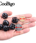 25 Pack Spring Cord Locks End Stops For Drawstrings And Shoelaces shown held in hand with size comparison to coins