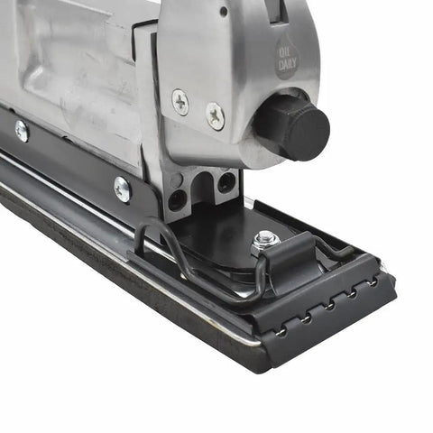 Close-up of the Inline And Straight Line Air Sander With Dual Piston Power, quick change tensioned paper clamps visible