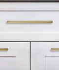 Six Pack 6 Inch Center To Center Brushed Brass Cabinet Pulls installed on white kitchen drawers